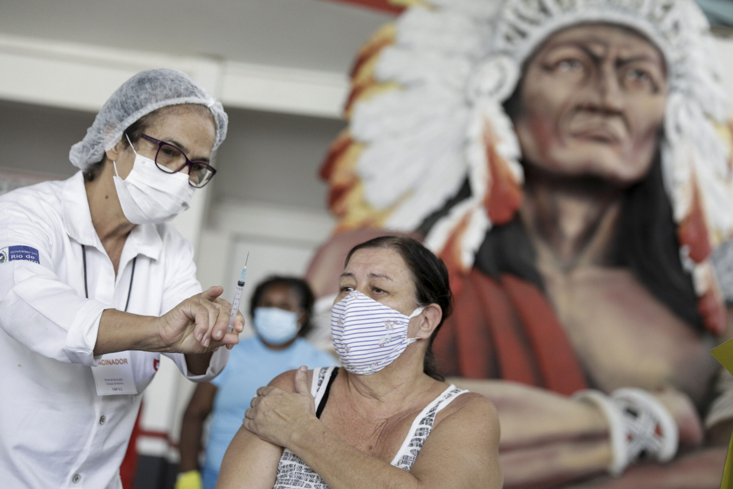 Brazil is experiencing surging infection rates. A healthcare worker gives a dose of Sinovac's CoronaVac COVID-19 vaccine at Cacique de Ramos, Rio de Janeiro, Brazil April 8, 2021.